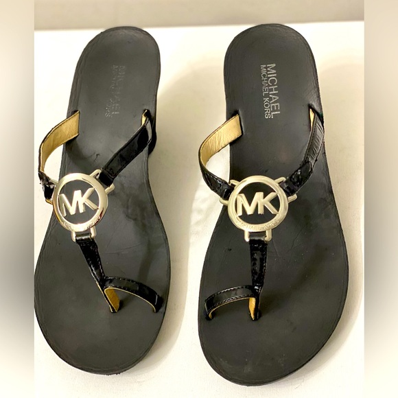 Michael Kors Shoes - Michael KORS sandals silver logo black wedge classic thong sandals. Size 9.5